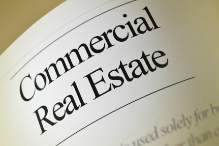 the words commercial real estate printed on a page